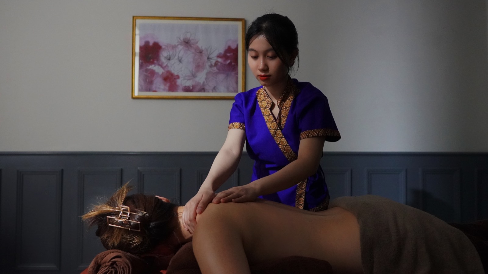 A massage treatment in warm light