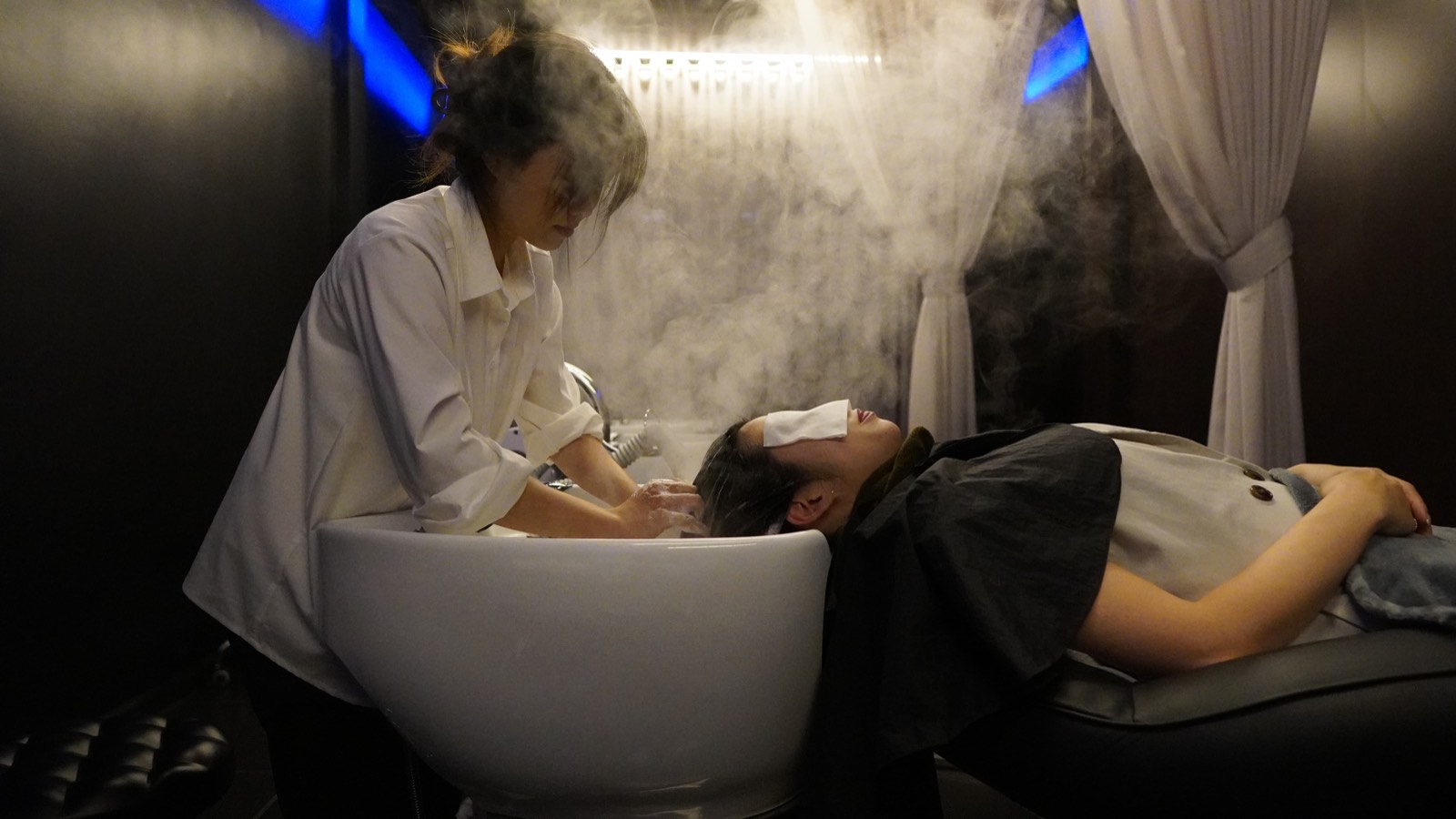 A head spa treatment with rising steam
