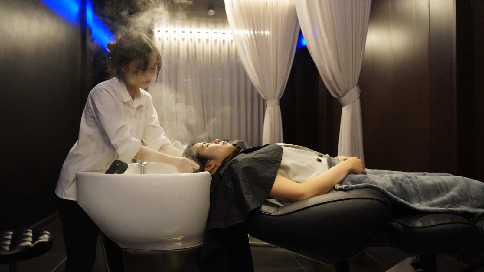 A head spa treatment wrapped in steam